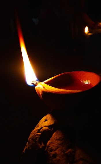 Close-Up Photo of Lighted Candle