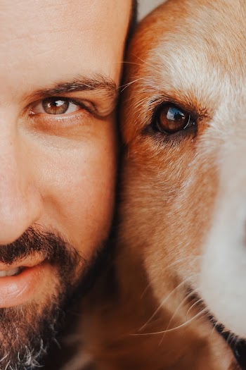 Close-Up Photo of Man and Dog