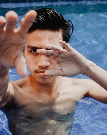 Close-Up Photo of Man Covering His Face