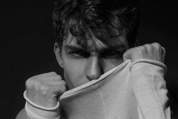 Close Up Photo of Man Covering His Mouth with His Clothes