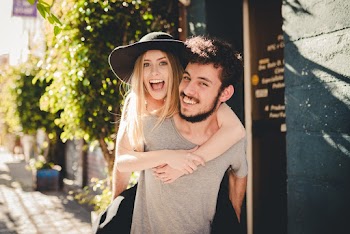 Close-up Photo of Man Giving Woman a Piggyback Ride