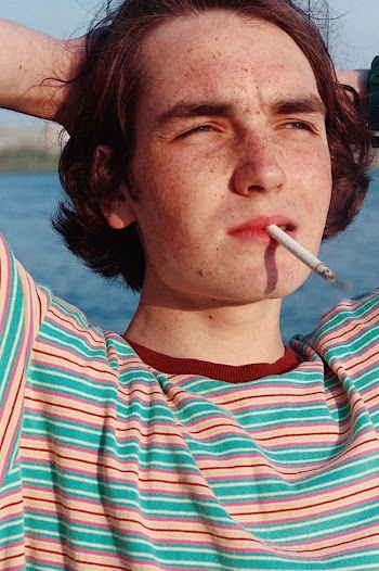 Close-up Photo of Man Posing With Cigarette in His Mouth