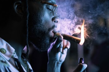 Close-Up Photo Of Man Smoking Cigar