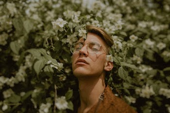 Close-Up Photo of Man Wearing Eyeglasses