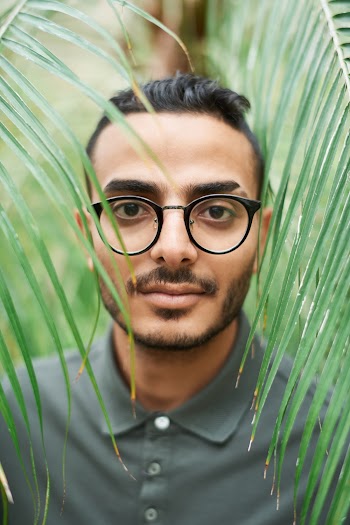Close-Up Photo of Man Wearing Eyeglasses