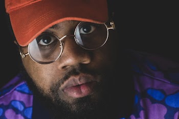 Close-Up Photo of Man Wearing Eyeglasses