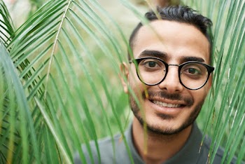 Close-Up Photo of Man Wearing Eyeglasses