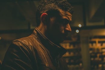 Close-Up Photo of Man Wearing Leather Jacket