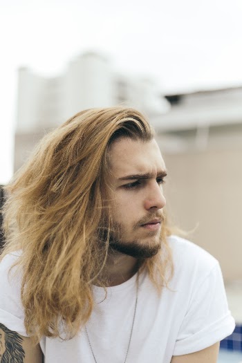 Close-Up Photo of Man With Long Hair