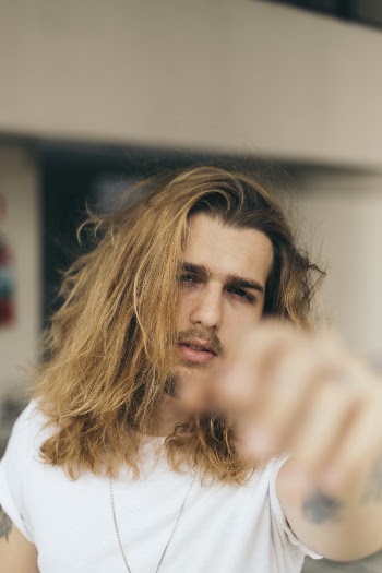 Close-Up Photo of Man With Long Hair
