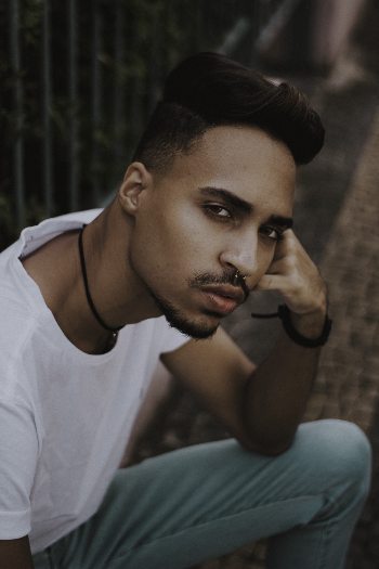 Close-Up Photo of Man With Nose Piercing