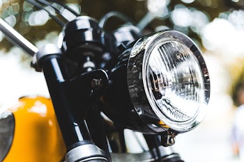 Close-Up Photo of Motorcycle Headlight