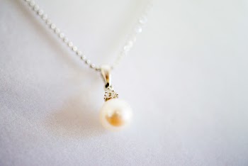 Close-Up Photo of Necklace With Pear Pendant