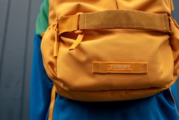 Close-up Photo of Orange Timbuk2 Backpack on Persons Back