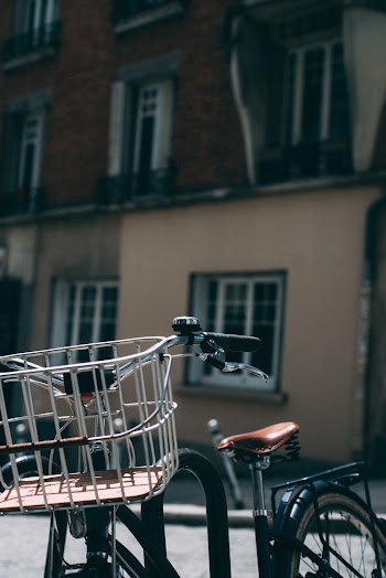 Close-up Photo of Parked City Bike with Building in the Background