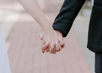 Close-Up Photo of People Holding Hands