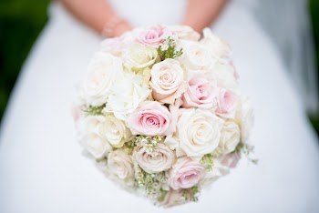 Close-Up Photo of Person Holding Bouquet of Flowers