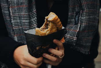 Close-Up Photo of Person Holding Bread