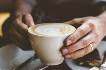 Close-Up Photo of Person Holding Cup of Coffee
