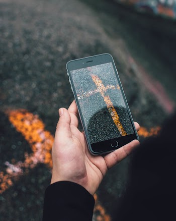 Close-Up Photo of Person Holding Iphone