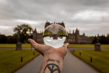 Close-Up Photo of Person Holding Lensball