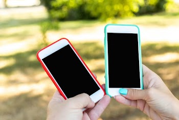 Close-Up Photo of Person Holding Smartphones
