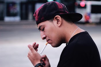 Close-Up Photo of Person Lighting A Cigarette