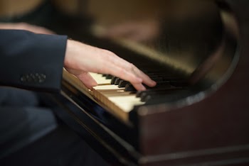 Close-Up Photo of Person Playing Piano