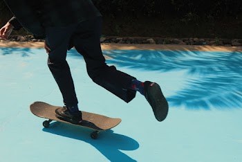 Close-up Photo of Person Skateboarding