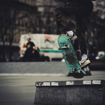 Close-up Photo of Person Skateboarding