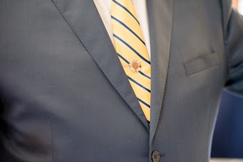 Close-Up Photo of Person Wearing Formal Attire