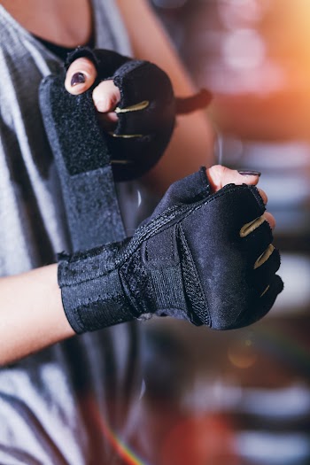 Close-Up Photo of Person Wearing Gloves