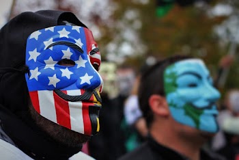 Close-Up Photo of Person Wearing Guy Fawkes Mask