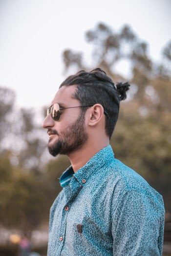 Close-Up Photo of Person Wearing Sunglasses