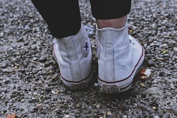 Close-Up Photo of Person Wearing White Converse