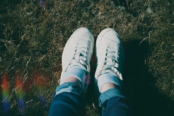Close-Up Photo of Person Wearing White Shoes