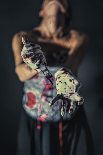 Close-up Photo of Person With Paint on Her Hands