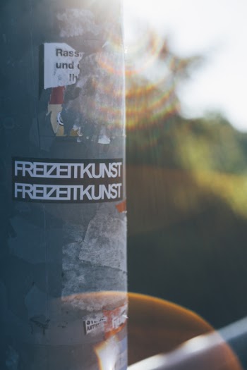 Close-Up Photo of Pole With Stickers