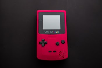 Close-up Photo of Red Game Boy Console