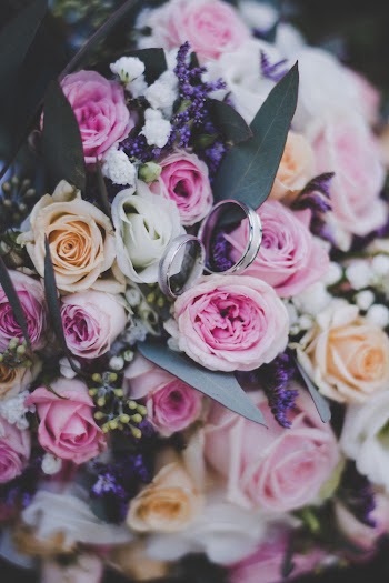 Close-Up Photo of Rings on Boquet