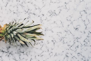 Close-up Photo of Ripe Pineapple Fruit on Marble Surface