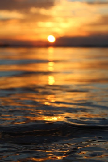 Close-Up Photo of Sea Water During Sunset