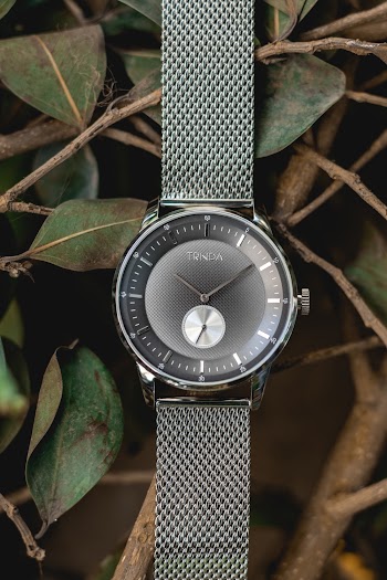 Close-Up Photo of Silver-colored Watch With Milanese Strap