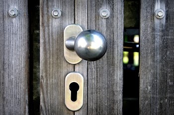 Close Up Photo of Silver Doorknob