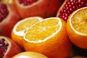 Close-up Photo of Sliced Orange and Grapefruit Fruits