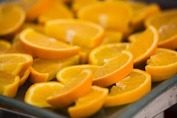 Close-up Photo of Sliced Orange Fruits on Gray Tray
