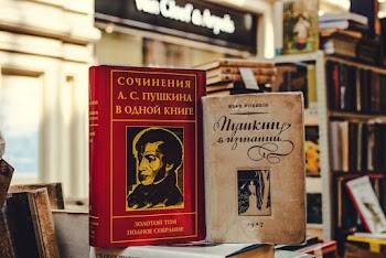Close-Up Photo Of Two Assorted Books