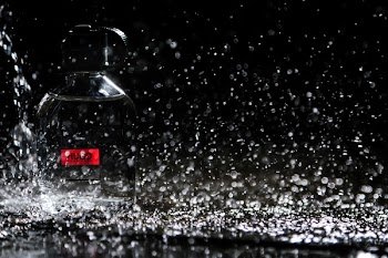 Close-up Photo of Water Drops on Bottle