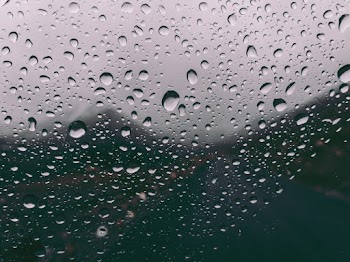 Close-Up Photo of Water Drops on Glass