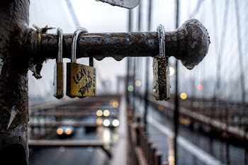 Close-Up Photo of Wet Padlocks